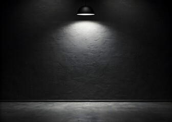 Single spotlight illuminates dark textured wall and floor in empty room