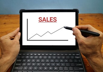 Business Sales Chart on Tablet Displayed for Financial Analysis