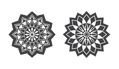 Two intricate circular floral patterns presented as dark silhouettes isolated on white background silhouette