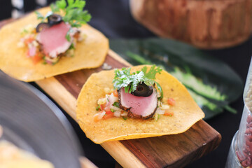 Gourmet Tuna Tacos on Wooden Board: Culinary Delight, Fresh Ingredients, Close-up.