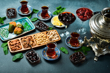 Tea ceremony. Azerbaijani traditional serving of tea. Tea, dried fruits and nuts. Top view.