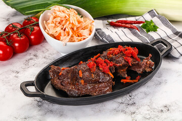 Baked beef cheeks with vegetables