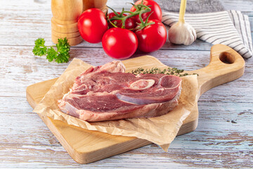 Raw lamb steak with bone