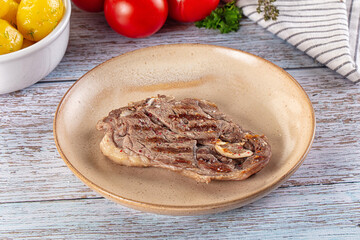 Grilled lamb steak with bone