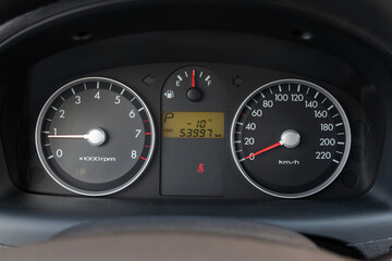 Fototapeta premium Vintage retro car dashboard with analog speedometer, tachometer and odometer, handmade for restoration