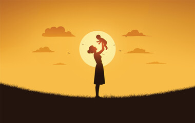 Silhouette of Mom Lifting Baby at Sunset in Meadow
