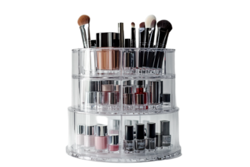 Elegant tiered makeup organizer filled with cosmetics on transparent background