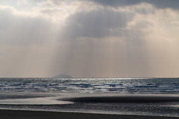 cloudscape and seascape with sunbeams