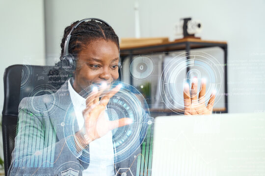 Woman interacting with futuristic virtual interface featuring holographic locks and data elements, symbolizing innovation, technology, cybersecurity, and progress in a modern office setting