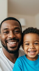 Joyful bond between father and son smiling together indoors
