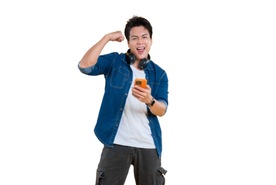 A cheerful young man celebrating with his phone and headphones on png background