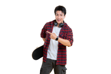 A young man smiling with a skateboard pointing with his finger  on png background