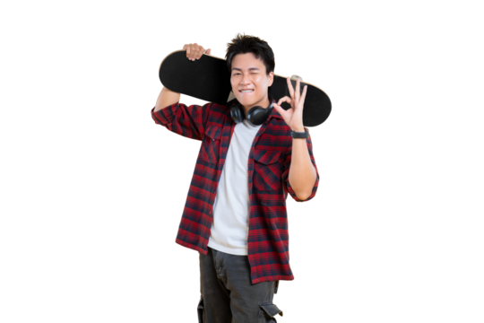 A young man with a skateboard, showing an okay gesture  on png background