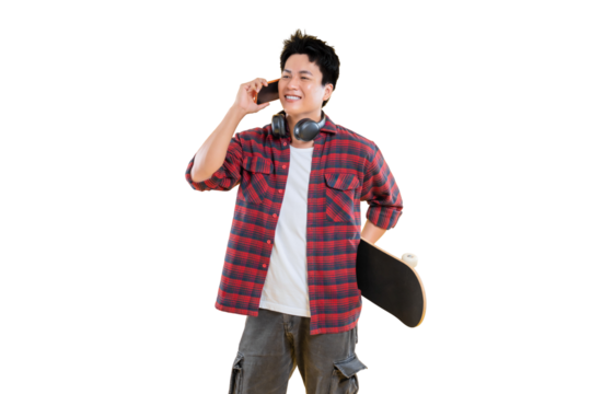 A young man talking on the phone, holding a skateboard, and wearing headphones  on png background