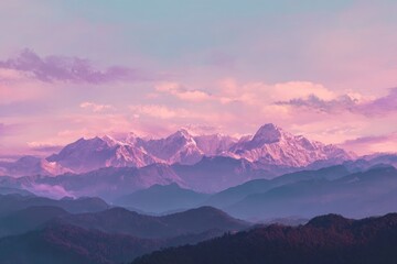 Obraz premium Sunrise over a majestic mountain range. Soft pastel hues paint a tranquil landscape