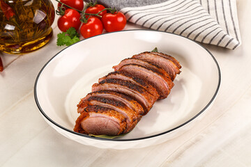 Sliced duck breast baked with cherry