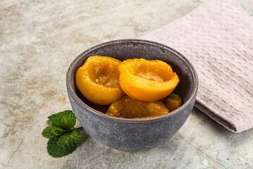 Canned marinated peach in syrop