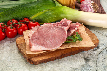 Raw pork steak loin with bone