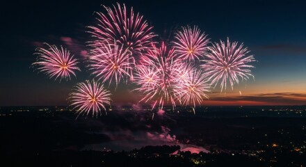 Vibrant Pink Fireworks Exploding Over Cityscape at Dusk, Illuminating the Night Sky for a Celebration