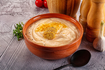 Tasty cheese cream soup with crouton