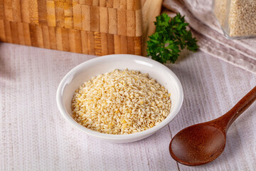 Raw dry sesame seeds heap