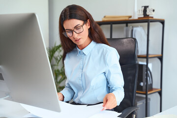 Professional Woman At Desk Reviewing Documents, Business Environment, Office Work, Analyzing...