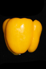 Close up of fresh sweet pepper on a black background