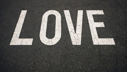 Word Love Painted on Asphalt Street