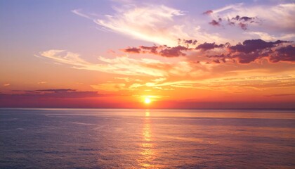 Obraz premium Colorful sunset over calm ocean