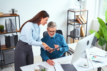 Professional Team Collaboration In Modern Office Setting Focused On technology And Strategy,...