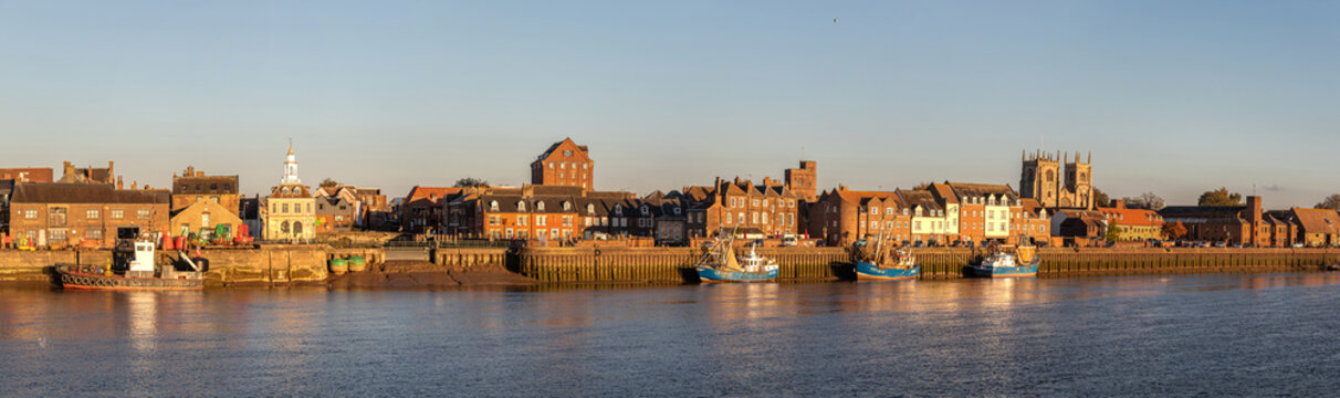 King's Lynn, England. Panoramic view from West Lynn at sunset with the Custom House, Purfleet tidal inlet, St Margaret's Cathedral towers, and Clifton House, an 18th-century merchant brick building