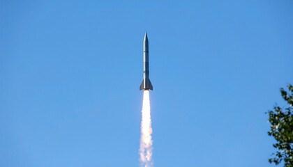 Rocket launching into clear sky