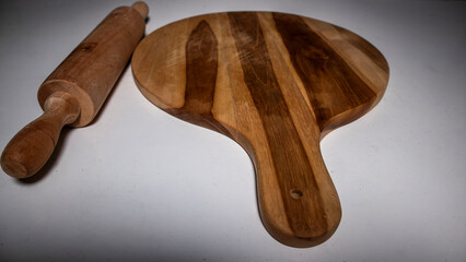 wooden cutting board and rolling pin