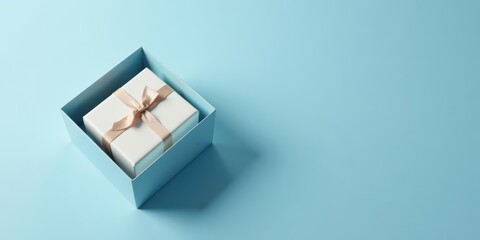 A delicately wrapped present nestled within a light blue box, a symbol of thoughtful gifting and joyous celebration