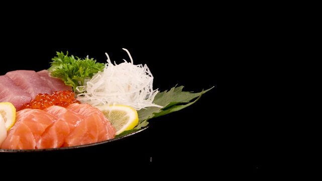 Rotating Plate of Salmon Roe and Sashimi Sushi Set