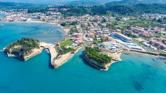 aerial landscape view of coastline area in Sidari and Melitsa,, located in north part of Corfu Island with turquoise water, beautiful bays, beaches, Cityscape and wooded hills  in background 