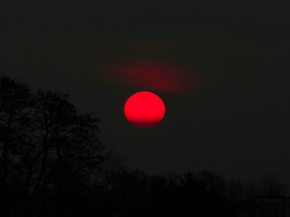 Beauty of nature. Red moon on dark sky.