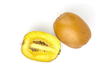 Fresh yellow kiwi fruit, whole and sliced, showcasing vibrant flesh and seeds, placed on a clean...