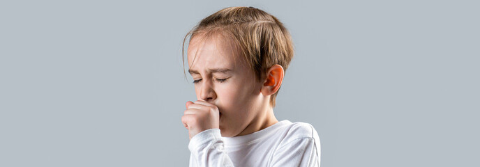 Portrait of an asian boy with coughing expression. Tired sick teen boy suffering from flu or cold and sore throat. Flu treatment. Boy coughing sick colds sneezing cough