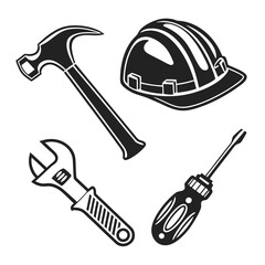 Black construction tools and hard hat hammer wrench