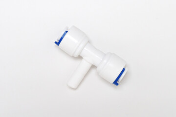 Installing a plastic connector for plumbing in a workshop