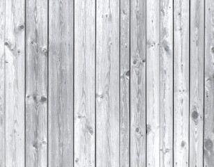Weathered wooden planks forming a rustic grey backdrop with natural grain details