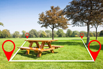 Land plot management - real estate concept with a vacant land on a field with trees and wooden new picnic table available for building construction
