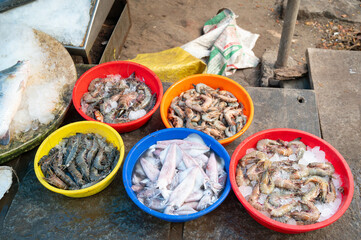 Fish variety on market in Kochi India, sale stall with freshly caught seafood, fishing industry at...