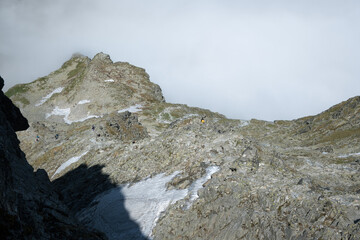 Mountain climbing looking down at the surrounding space.
