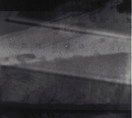 A photo showcasing a 400 ISO medium format 120 roll film grain texture, with fingerprint smudges and scratches from improper exposure, exuding a raw, vintage charm