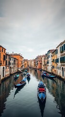 Obraz premium Photo of venetian canal with gondolas navigating between colorful historic buildings