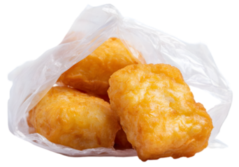 Crispy golden fried cheese curds in a clear plastic bag, ready for snacking at a fair or festival