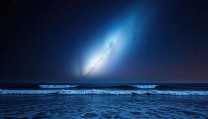 Glowing nebula above an ocean horizon, with waves gently crashing under the starlit sky