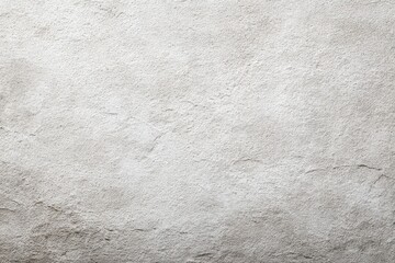Obraz premium A closeup shot reveals a textured lightgray stone surface with subtle variations in tone and texture
